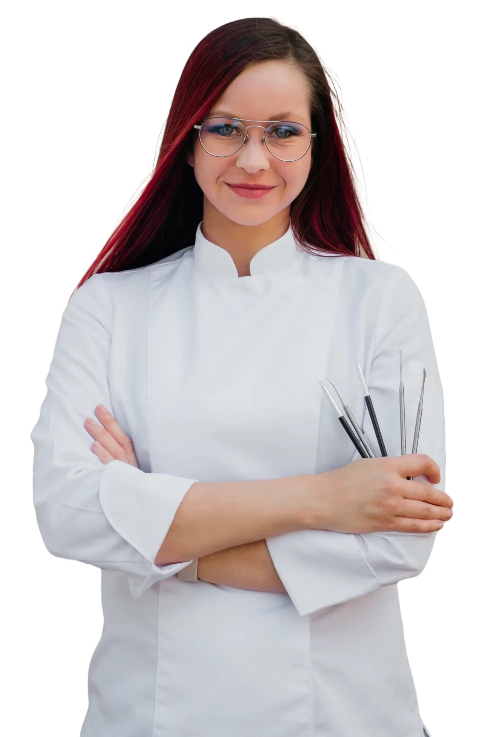 Eliška Hebká, cukrářka v bílém rondonu držící modelovací nástroje pro dortové figurky